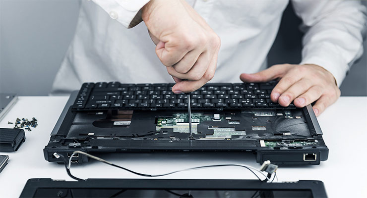 technician opening a laptop